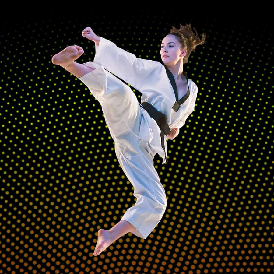 Martial Arts Lessons for Adults in Staten Island NY - Girl Black Belt Jumping High Kick