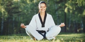 Martial Arts Lessons for Adults in Staten Island NY - Happy Woman Meditated Sitting Background